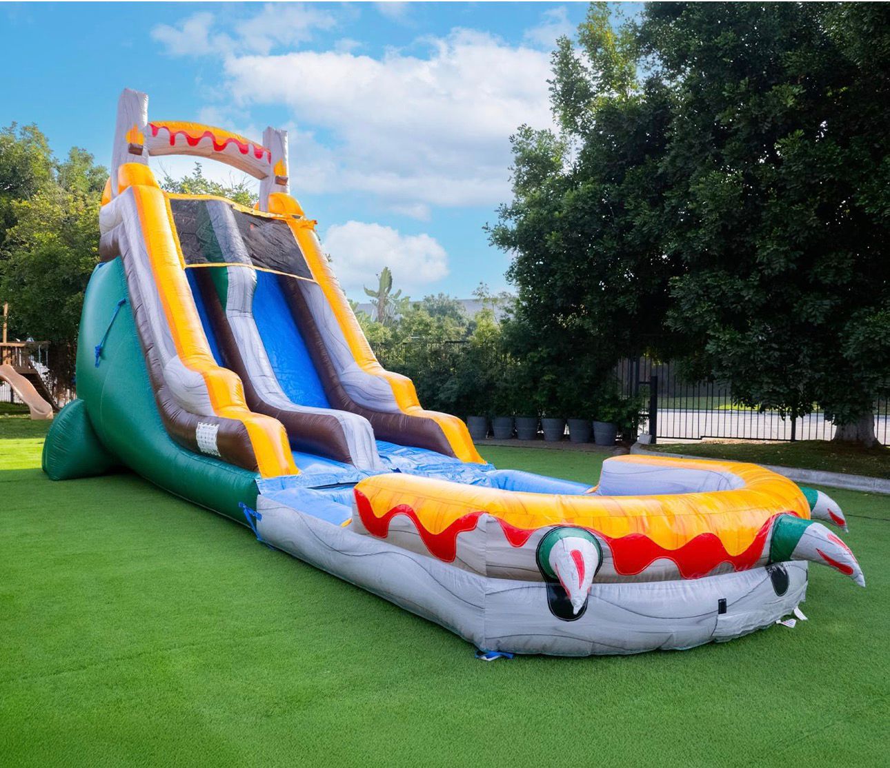 Large colorful inflatable water slide combo rental — yellow and blue dragon-themed bounce house with pool for kids parties in Central Florida