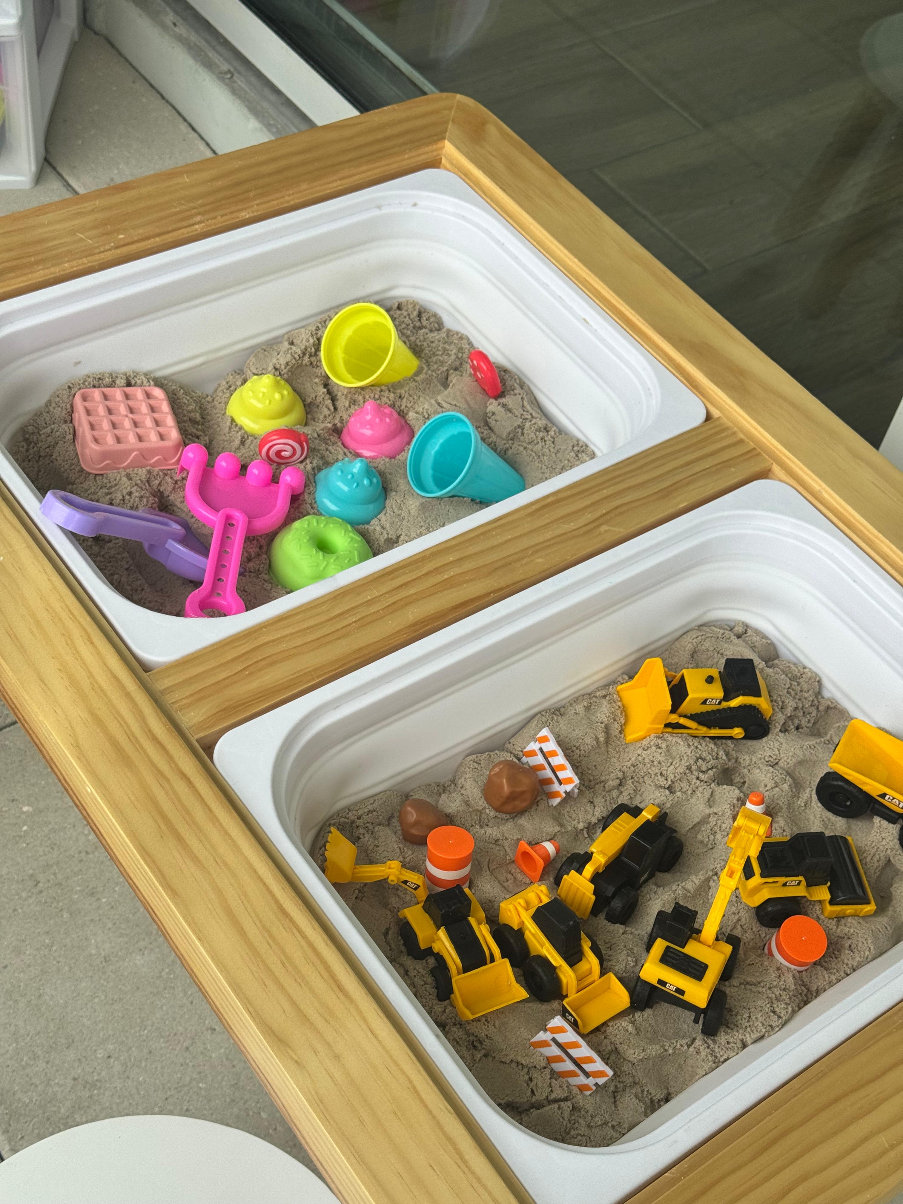 Kinetic sand sensory table with shapes, molds and tools